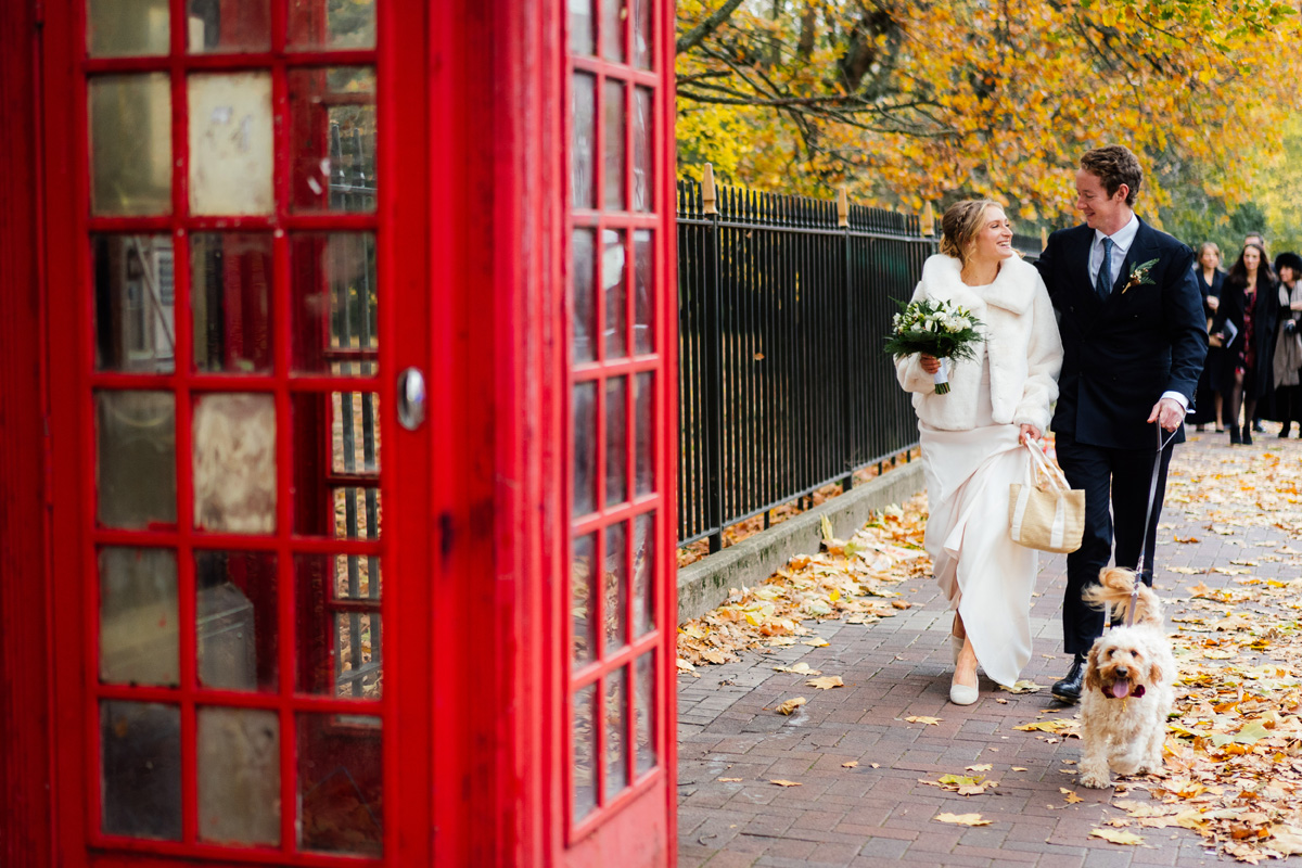 Bride and groom walk to their wedding at Battersea Park